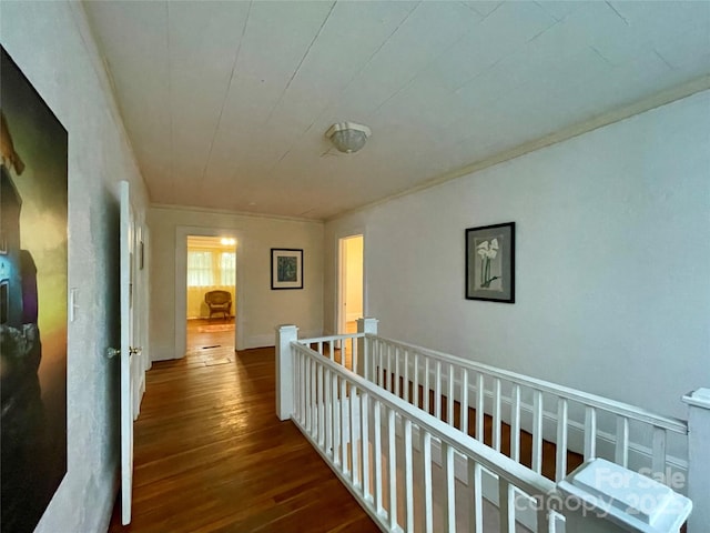 hallway with ornamental molding and dark hardwood / wood-style floors