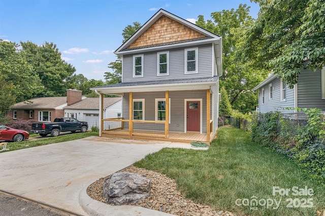 front of property featuring a front lawn and covered porch