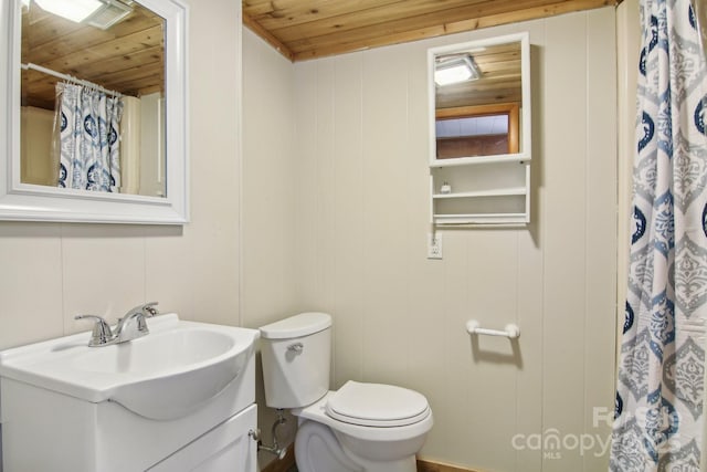 full bathroom with vanity, curtained shower, toilet, and wood ceiling