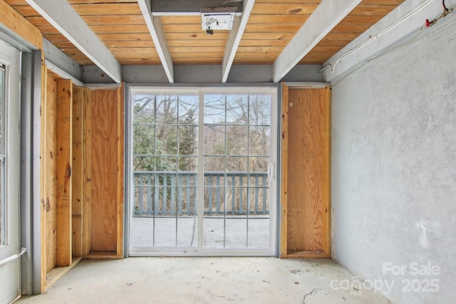 interior space featuring beam ceiling and wood ceiling