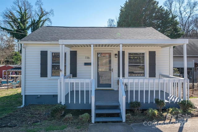 bungalow featuring covered porch, a shingled roof, and crawl space