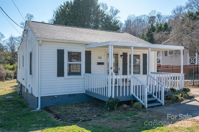 view of front of house featuring crawl space, covered porch, and a shingled roof