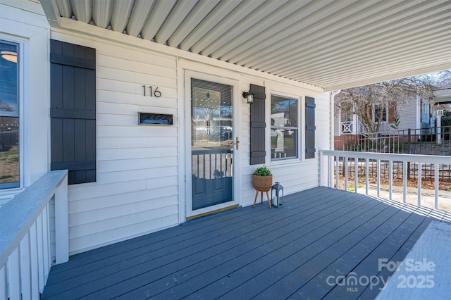 wooden terrace with a porch