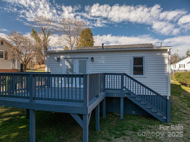 back of house with a lawn, stairway, and a wooden deck