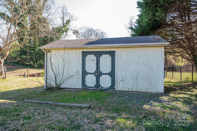 view of shed with fence