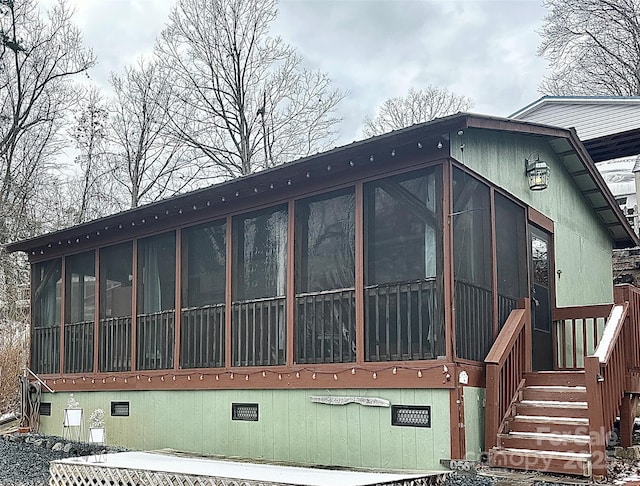 view of home's exterior with crawl space