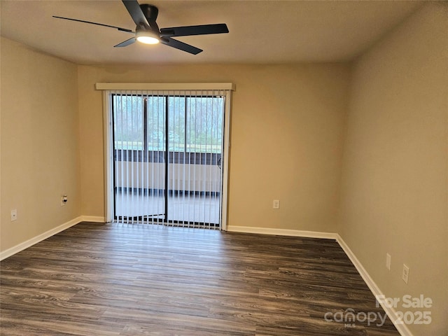 empty room featuring ceiling fan and dark hardwood / wood-style flooring