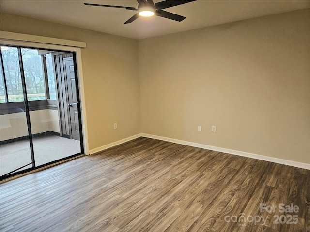 empty room with hardwood / wood-style flooring and ceiling fan