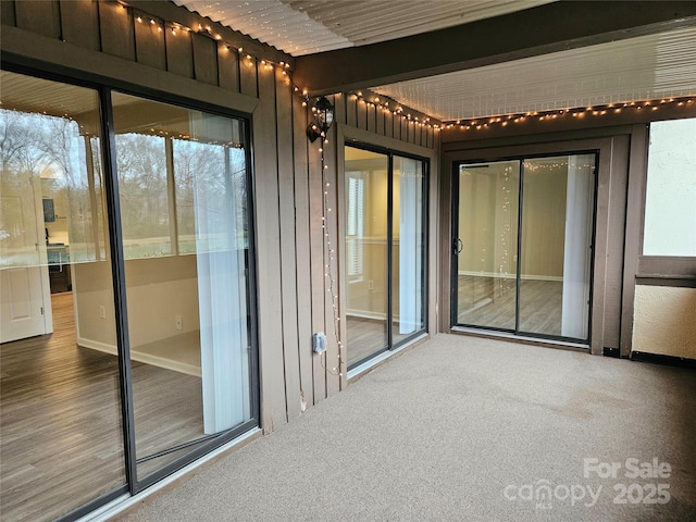 unfurnished sunroom featuring a wealth of natural light