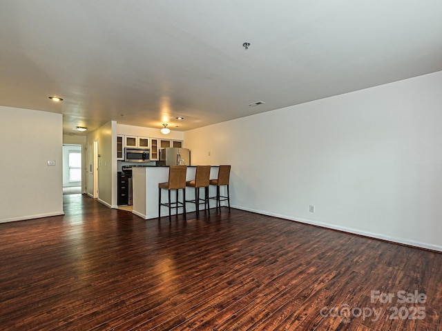 living room with dark hardwood / wood-style flooring