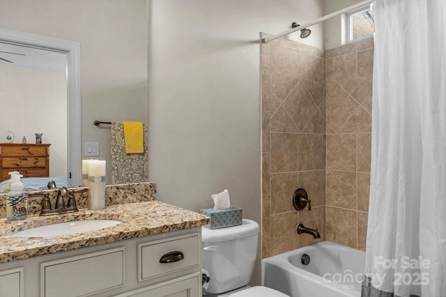 full bathroom featuring vanity, shower / tub combo, and toilet