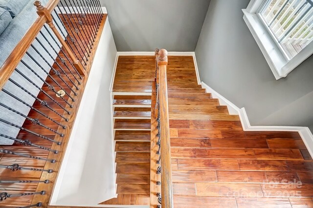 stairs featuring baseboards