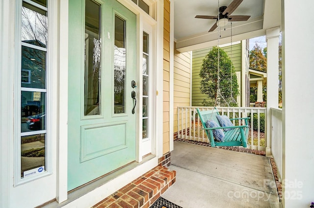 view of exterior entry with ceiling fan