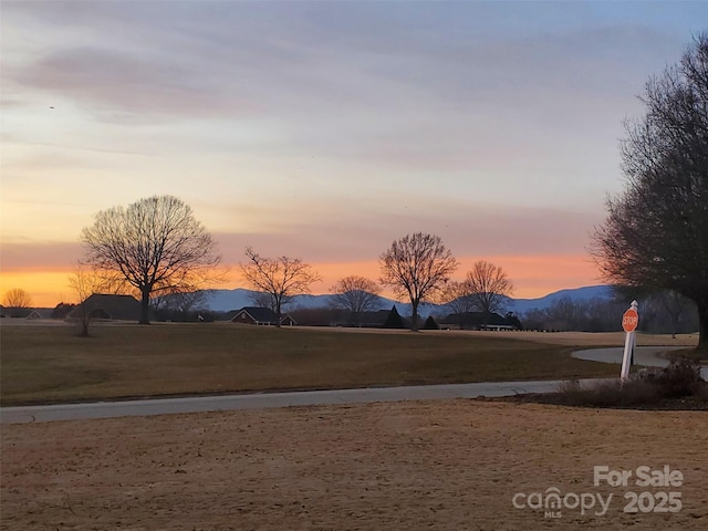 yard at dusk with a mountain view