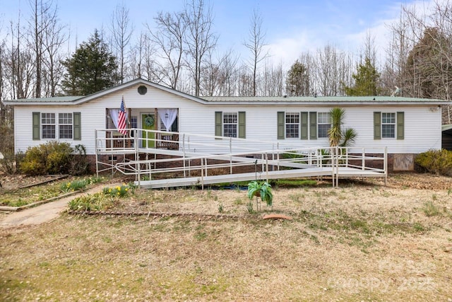 manufactured / mobile home featuring metal roof