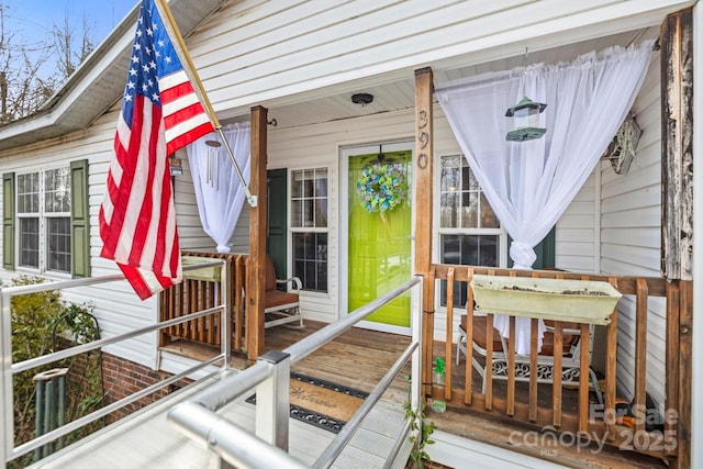 doorway to property featuring covered porch