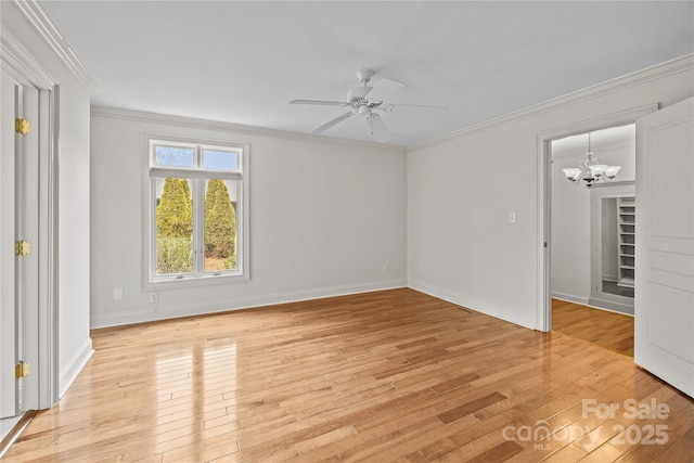 empty room with crown molding and light wood-type flooring