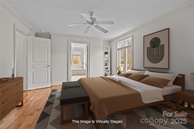 bedroom featuring ornamental molding, multiple windows, and light wood-type flooring