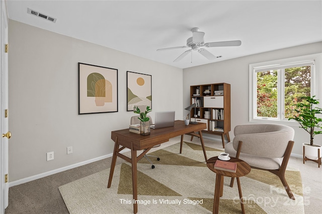 home office featuring carpet floors and ceiling fan