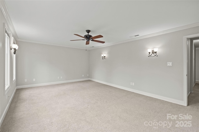 unfurnished room featuring crown molding, carpet floors, and ceiling fan