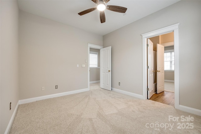 unfurnished bedroom with light carpet and ceiling fan