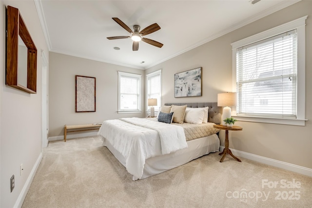 carpeted bedroom with ornamental molding and ceiling fan