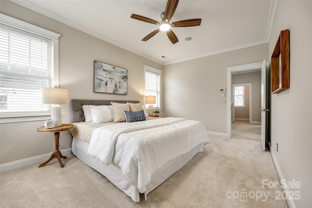 bedroom with crown molding, light carpet, and ceiling fan