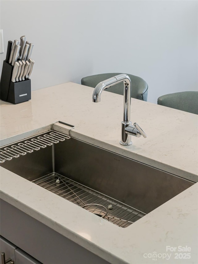 45 Asheland Ave Unit 302, Asheville, NC 28801 - interior details featuring light stone counters and sink