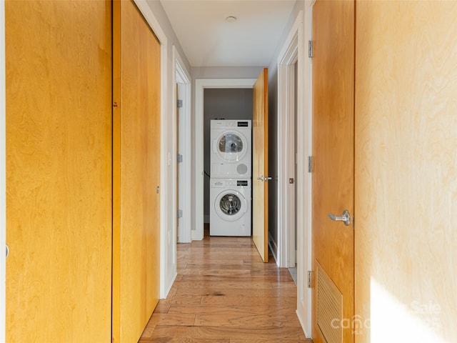 45 Asheland Ave Unit 302, Asheville, NC 28801 - hallway with stacked washer and clothes dryer and light wood-type flooring