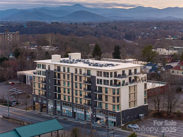 45 Asheland Ave Unit 302, Asheville, NC 28801 - aerial view at dusk featuring a mountain view