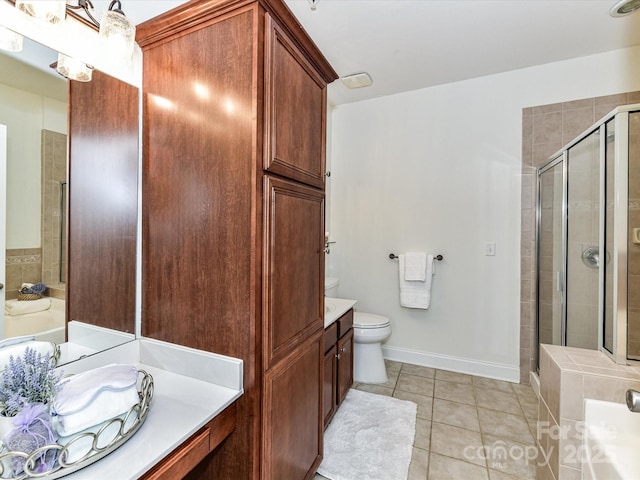 bathroom with vanity, tile patterned flooring, toilet, and a shower with shower door