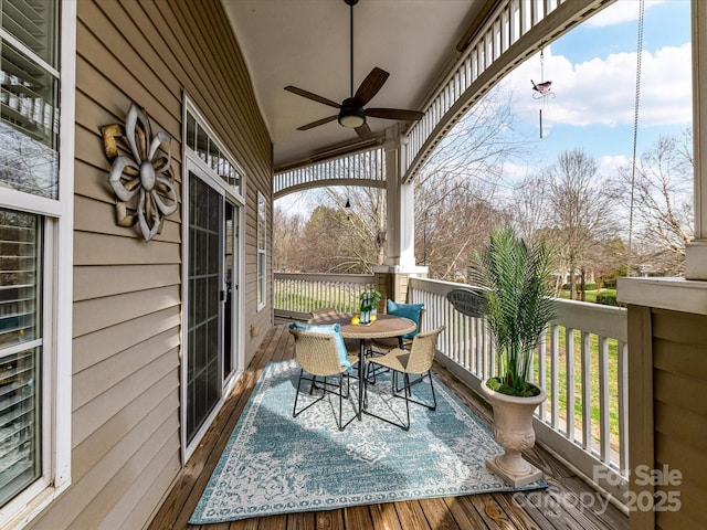 wooden deck with ceiling fan