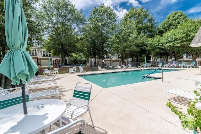 view of swimming pool with a patio area