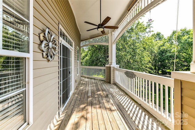 8925 Rosalyn Glen Rd, Cornelius, NC 28031 - porch with a ceiling fan and view of scattered trees