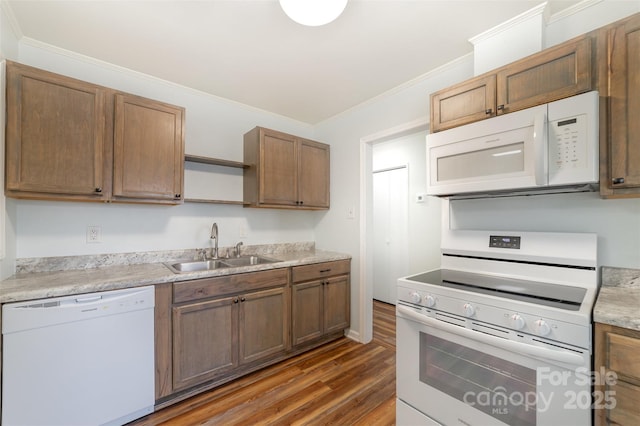 kitchen featuring white appliances, open shelves, ornamental molding, light countertops, and a sink