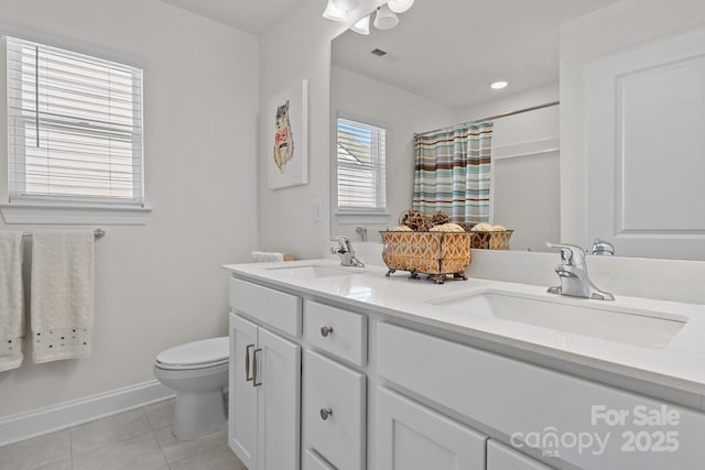 bathroom with toilet, a sink, tile patterned flooring, and visible vents