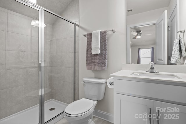 full bath with toilet, visible vents, a stall shower, and ceiling fan