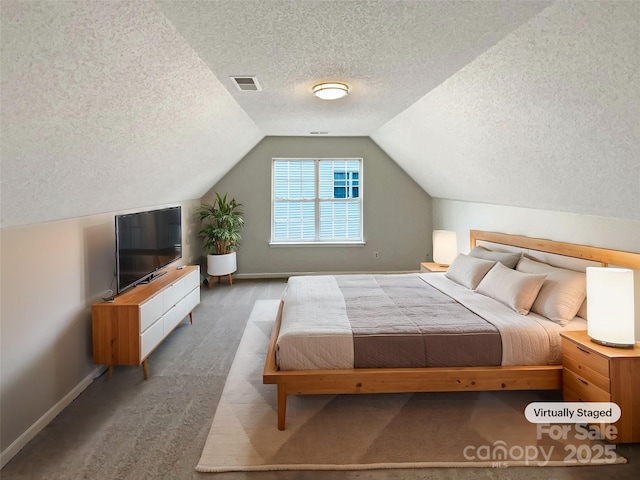 bedroom with vaulted ceiling, carpet, visible vents, and baseboards