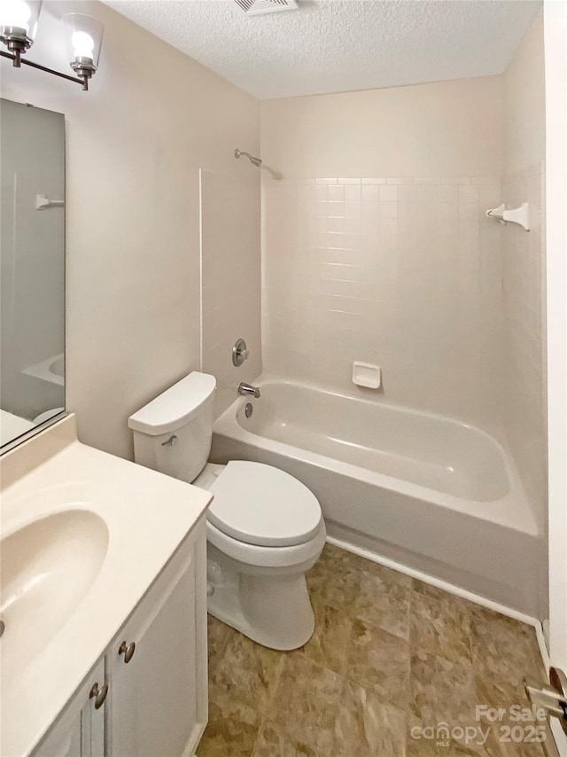 bathroom with a textured ceiling, toilet, visible vents, vanity, and washtub / shower combination