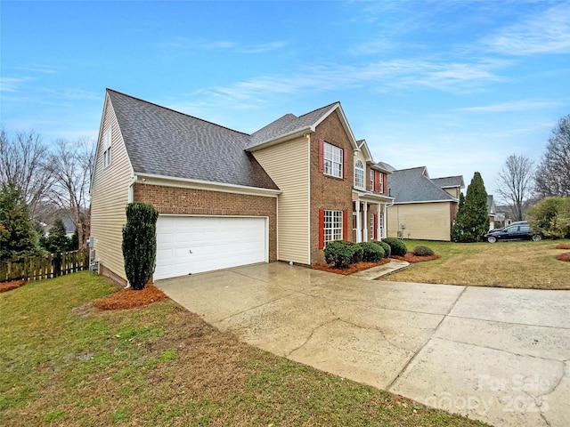 view of front of home featuring a garage, a front yard, and brick siding