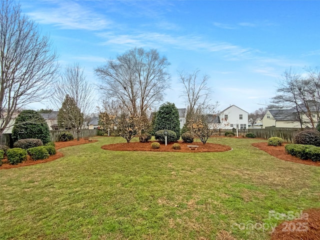 view of yard with a residential view and fence