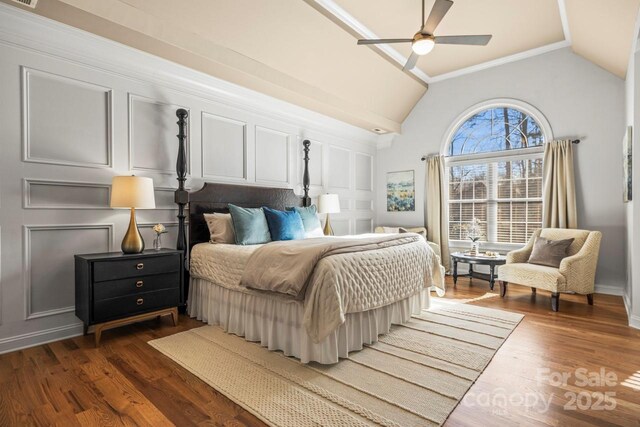 bedroom featuring vaulted ceiling, dark hardwood / wood-style floors, and ceiling fan