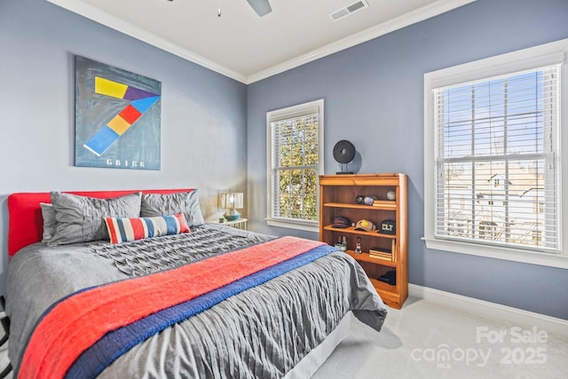 carpeted bedroom featuring ceiling fan and ornamental molding