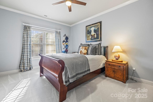 bedroom with ceiling fan, crown molding, and light carpet