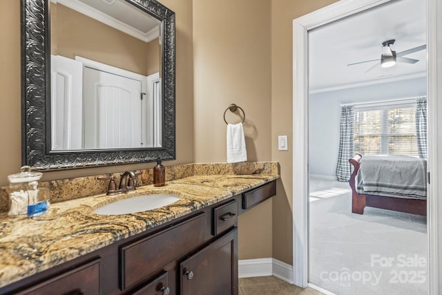 bathroom featuring tile patterned floors, ceiling fan, vanity, and ornamental molding