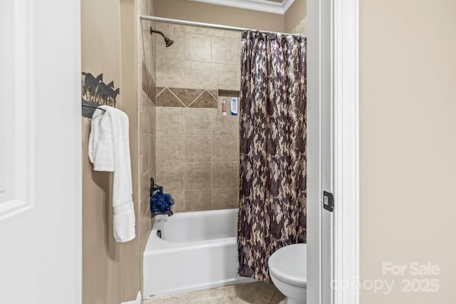 bathroom featuring shower / tub combo with curtain, tile patterned flooring, and toilet