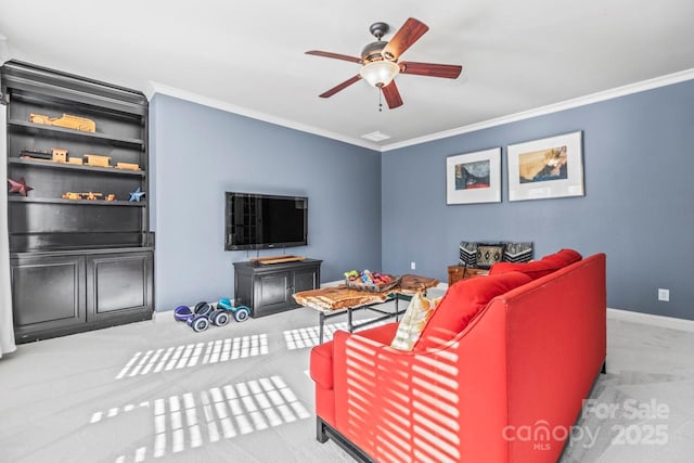 carpeted living room with crown molding and ceiling fan