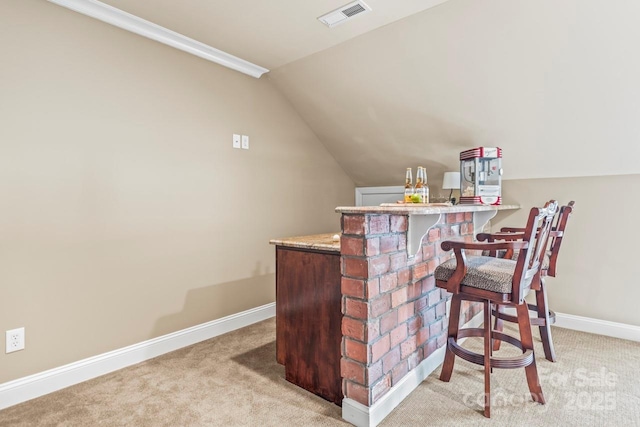 bar with light carpet and lofted ceiling