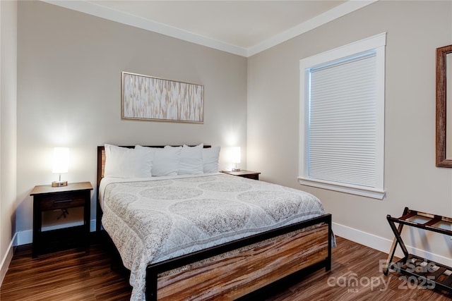 bedroom with dark wood-style floors and baseboards