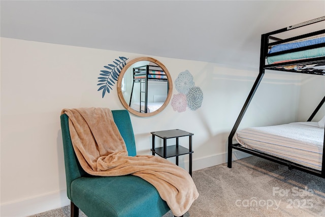 bedroom with carpet floors and baseboards